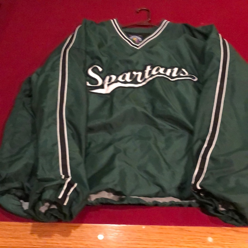 Michigan State Wind Shirt. Heavy duty. Pockets fo have holes.